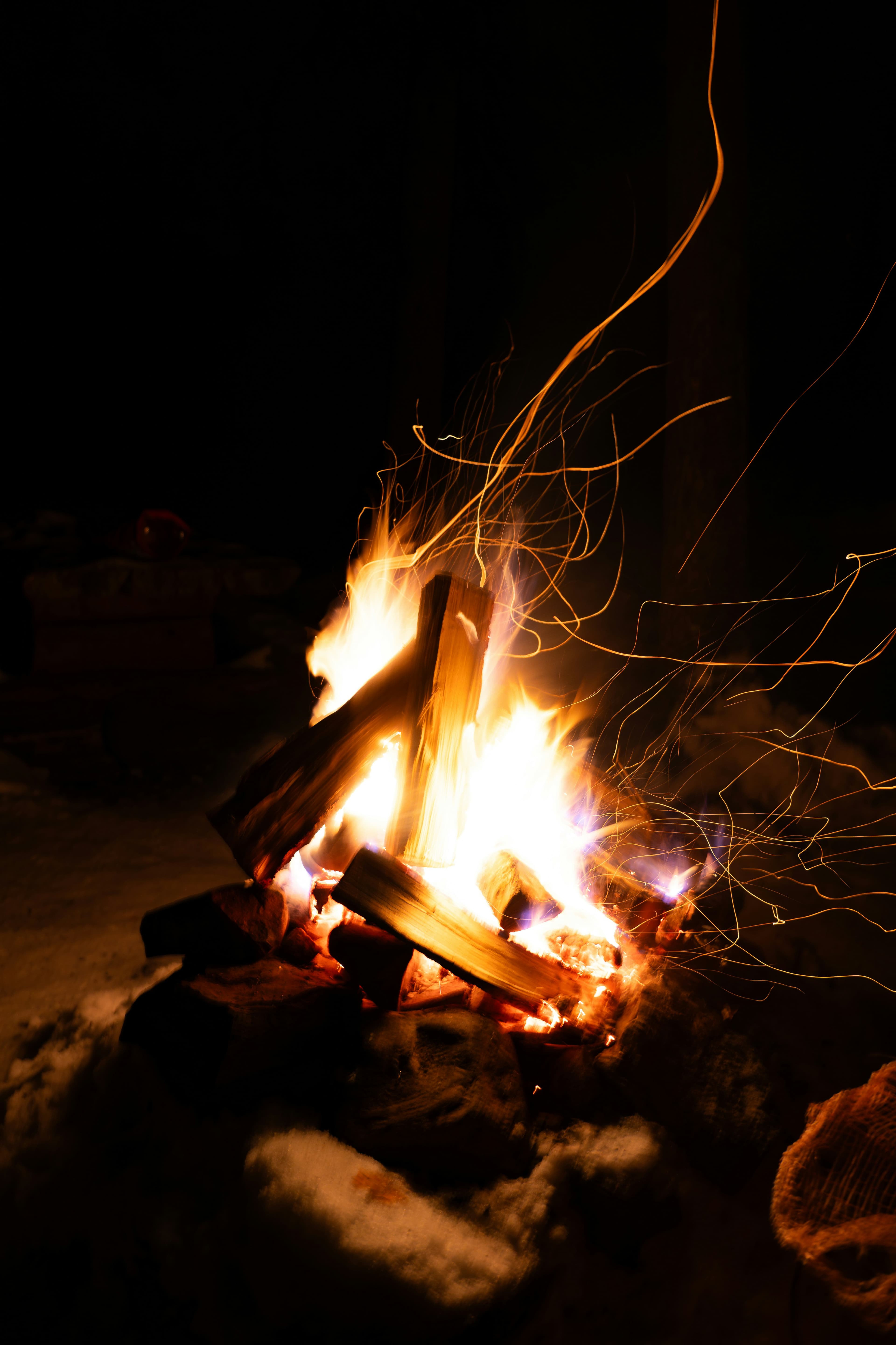 Campfire in African wilderness under night sky